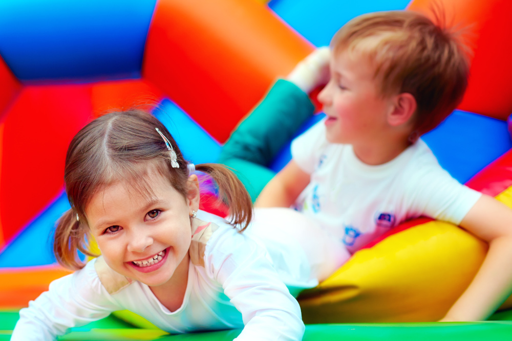 Two children in a colourful soft play area