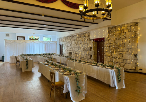 Room set up for a wedding meal at Broomhall Castle